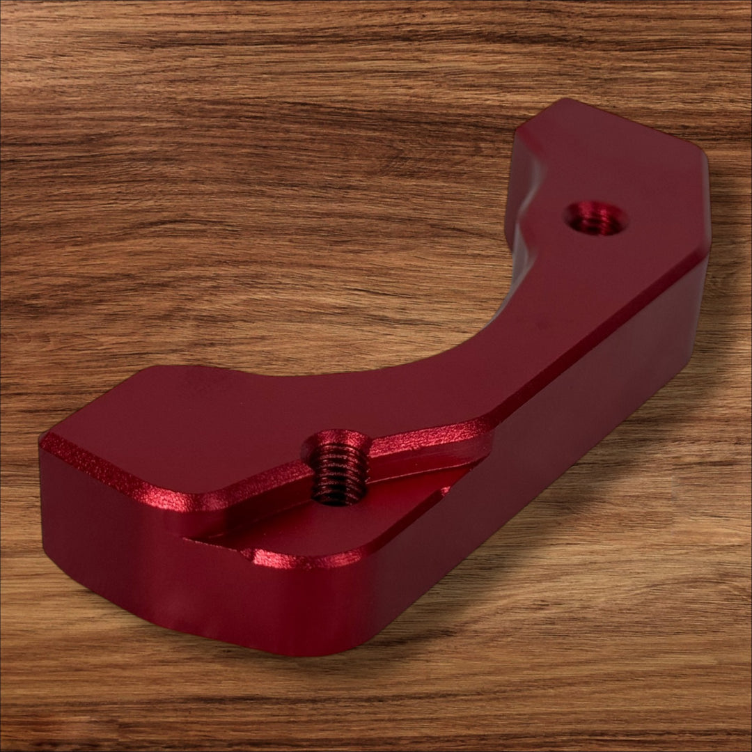 Electro & Co ETM RTR anodized brake brackets set in black, red, blue, green, and purple for front and rear bike brake mounts.