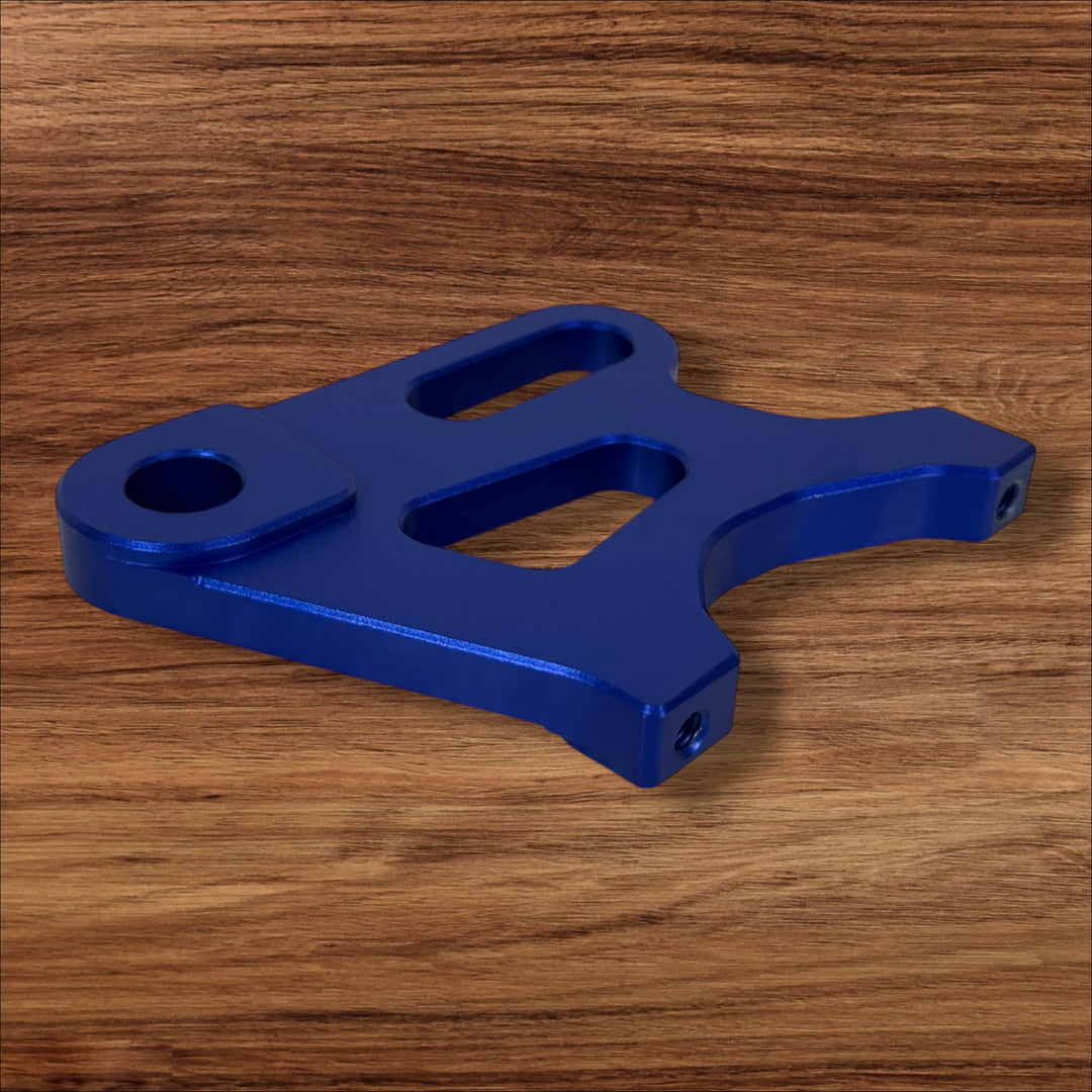 Electro & Co ETM RTR anodized brake brackets set in black, red, blue, green, purple for front and rear bike brake systems.