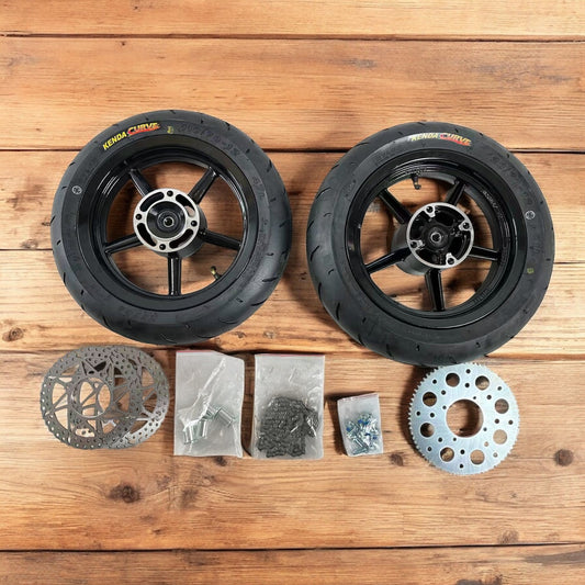 Electro & Co ETM RTR 12-inch mag wheel set with Kenda tires, rotors, sprocket, and chain installed on a motorcycle.