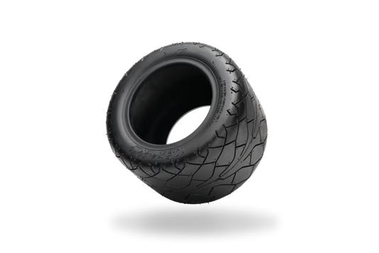 Onewheel Pint performance tire with all-terrain tread pattern, designed for off-road riding on a rugged electric skateboard.