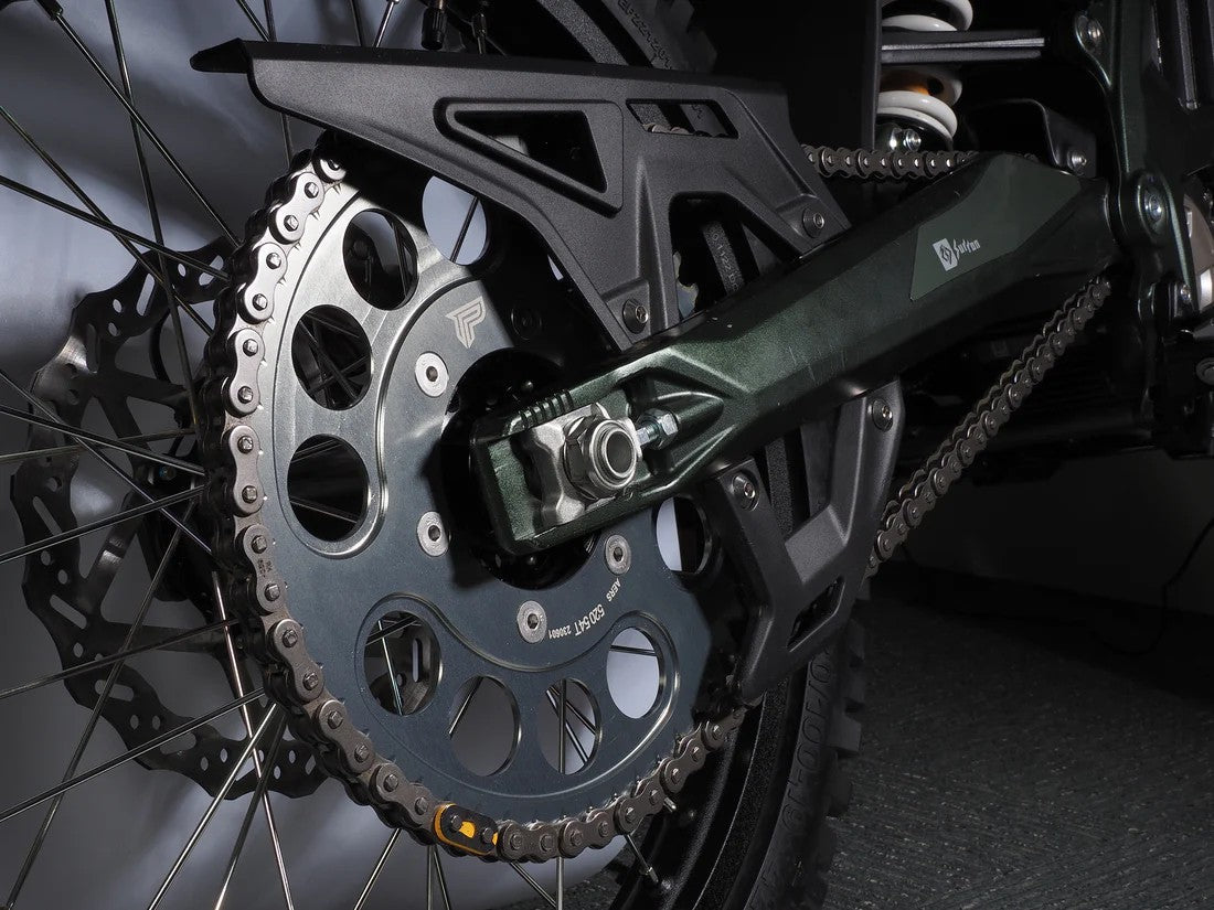 Black eDirtyBike Power Link Rear Sprocket for Surron Ultra Bee mounted on bike, showcasing durable metal design.