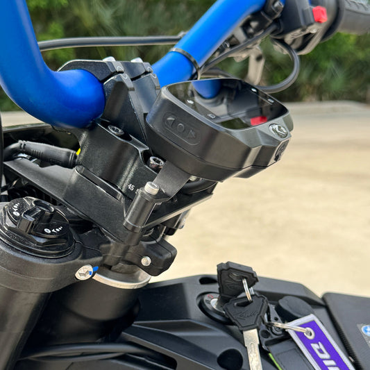 Rawrr Mantis X display relocation bracket kit installed on eDirtyBike, showcasing electrical component adjustment on the bike.