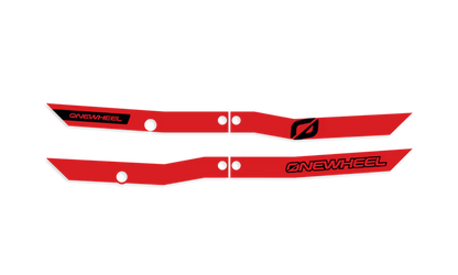 Red Onewheel XR Classic Recurve Rail Guards installed on skateboard rails, providing protection and style for the electric skateboard.