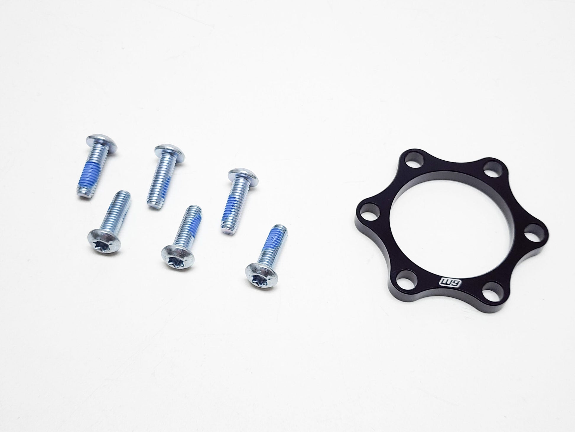 Warp9Racing Surron and Talaria front wheel boost spacer, 5mm thick, for enhanced wheel stability and performance.