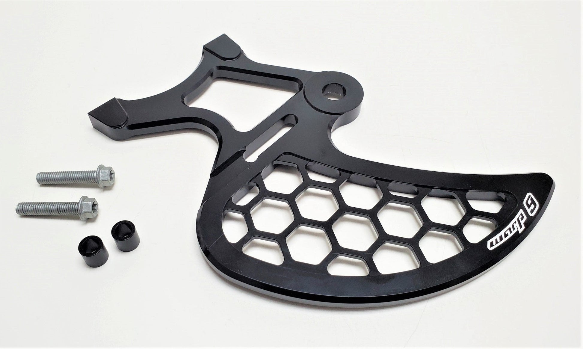 Warp9Racing Surron rear disk guard mounted on the rear brake disc, providing protection with a sturdy metal design.