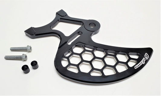 Warp9Racing Surron rear disk guard mounted on the rear brake disc, providing protection with a sturdy metal design.