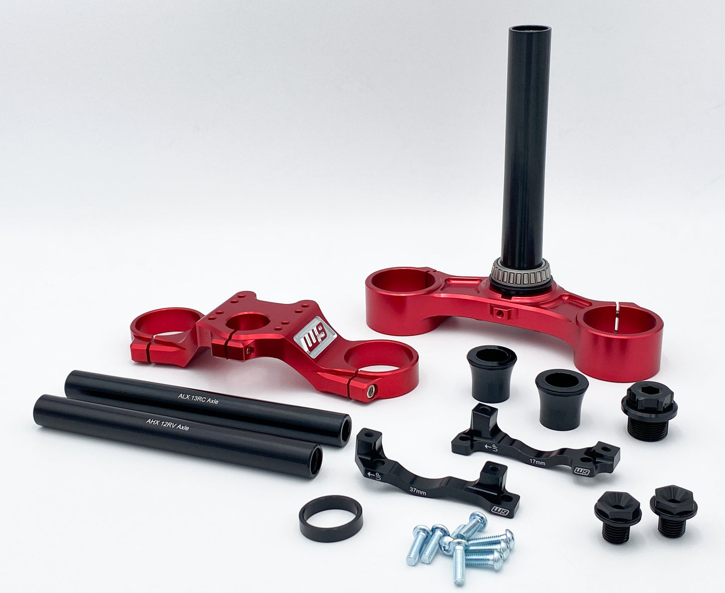Warp9Racing FastAce Triple Clamps shown in black with silver mounting points, designed for motorcycle handlebar stability and performance.