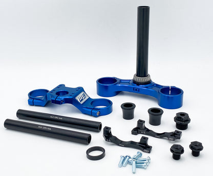 Warp9Racing FastAce Triple Clamps shown in black, featuring a sturdy, precision-machined design for motorcycle handlebar stability.