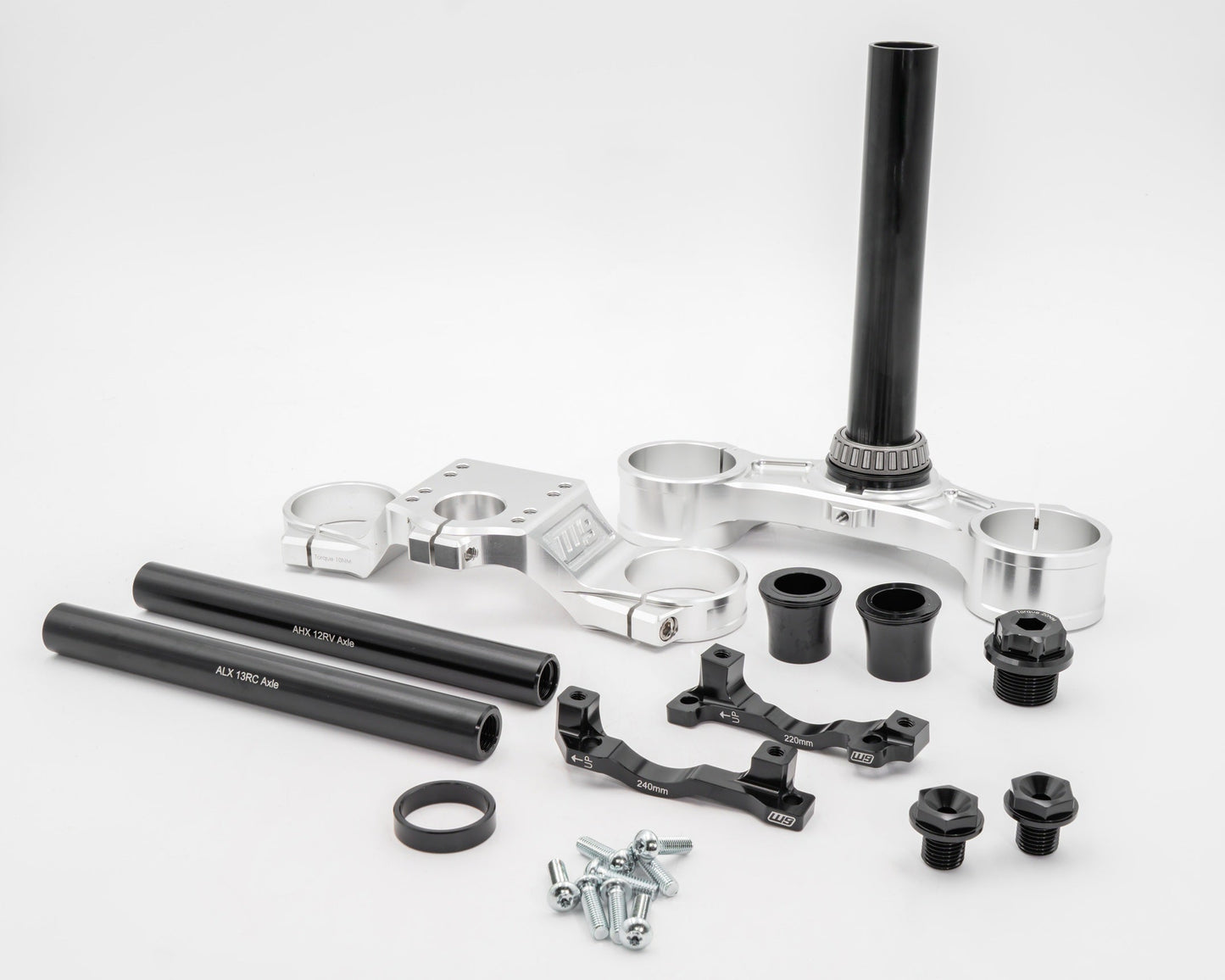 Warp9Racing FastAce Triple Clamps shown in the image, featuring sturdy metal construction and precise fit for motorcycle handlebars.