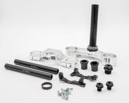 Warp9Racing FastAce Triple Clamps shown in the image, featuring sturdy metal construction and precise fit for motorcycle handlebars.