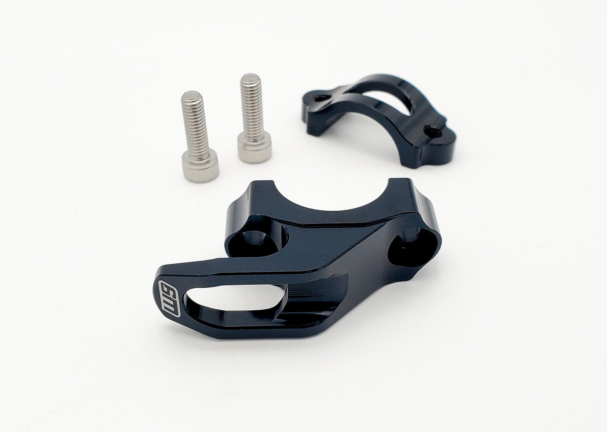 Warp9Racing helmet hook mounted on a wall, designed for easy helmet storage and organization.