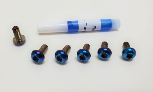 E-Moto Titanium Rotor Bolts by Warp9Racing, displayed in a kit with raw titanium finish, designed for motorcycle brake rotors.