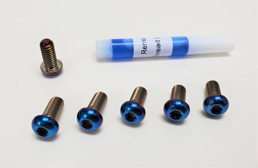 E-Moto Titanium Rotor Bolts for Surron electric bikes by Warp9Racing, shown in a close-up image of the bolt set.