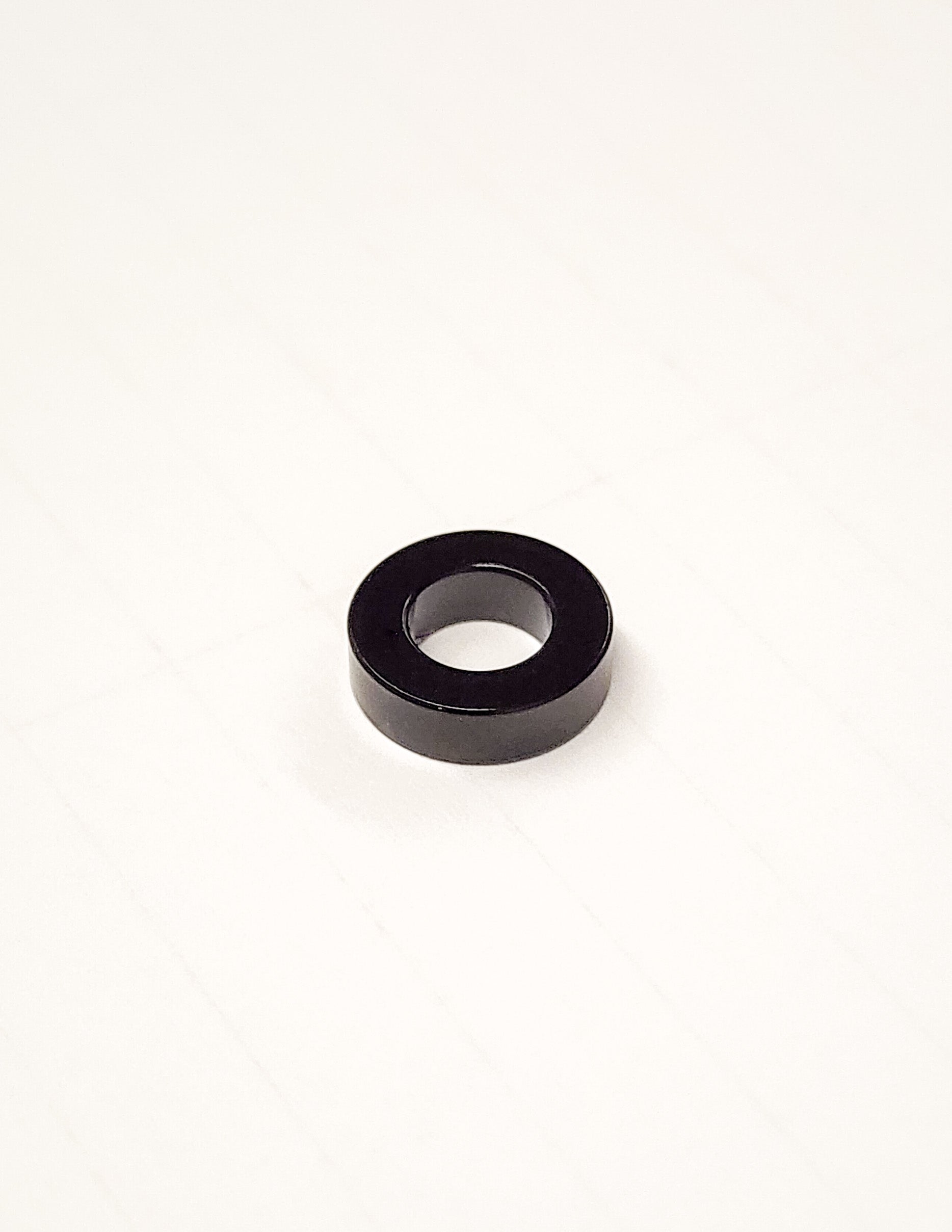 Warp9Racing Ultra Bee Seat Spacer for bike seat adjustment, showing the black spacer with mounting hardware.
