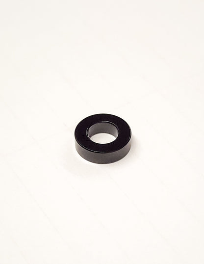 Warp9Racing Ultra Bee Seat Spacer for bike seat adjustment, showing the black spacer with mounting hardware.