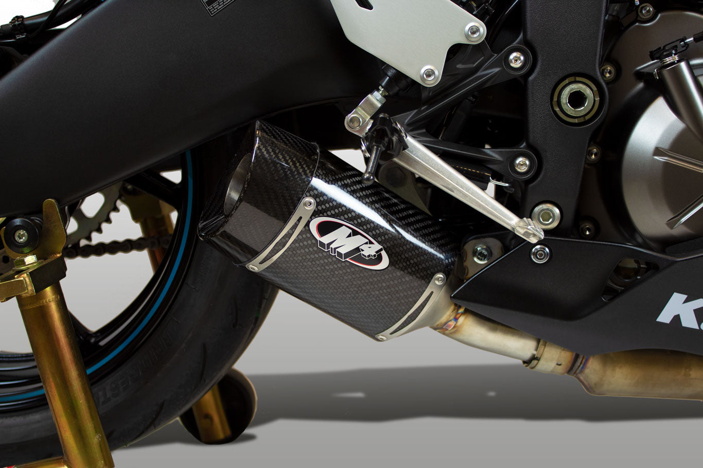 Close-up of Bill's Exhausts carbon fiber street slayer slip-on exhaust for Kawasaki ZX6R 2009-2026 model.