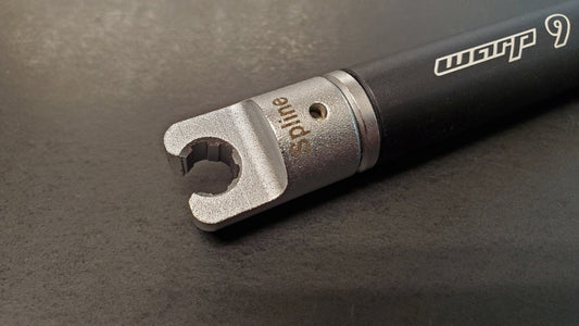 Warp9Racing spline tip spoke wrench for bike wheel adjustments, featuring adjustable design and durable metal construction.