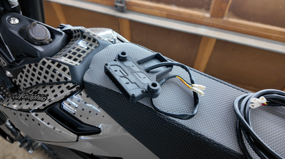 Project9 Surron Ultra Bee brake light, plug-and-play safety upgrade, compact lighting and electrical component for enhanced visibility.