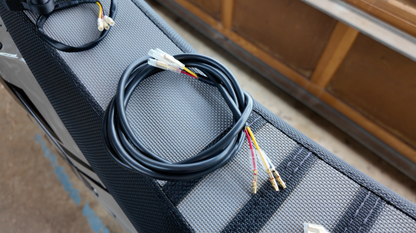 Project9 Surron Ultra Bee brake light, a plug-and-play safety upgrade, featuring LED lighting and electrical components for enhanced visibility.