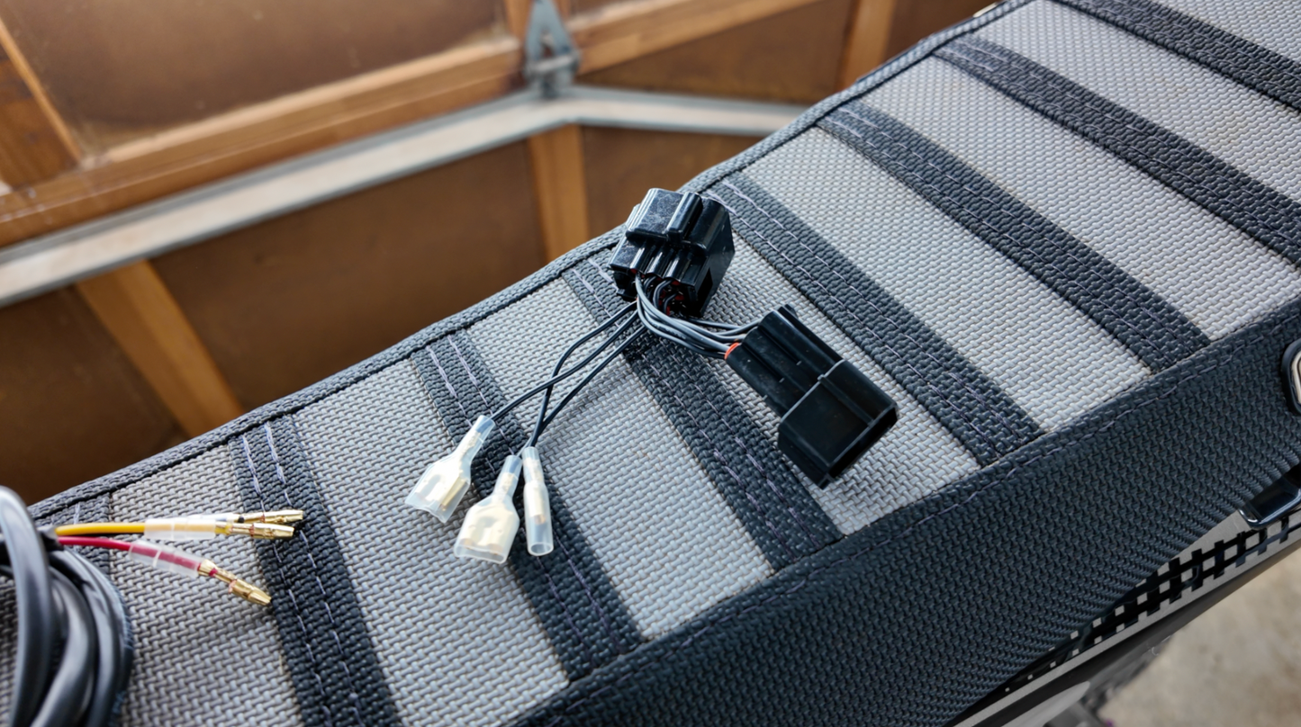 Project9 Surron Ultra Bee brake light, plug-and-play safety upgrade, mounted on electric bike with wiring and LED indicator.