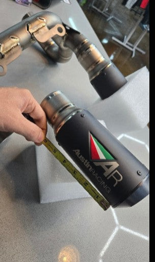 Austin Racing 2025 Ducati Panigale V2 race de-cat pipe, high-performance motorcycle exhaust part in a detailed close-up image.
