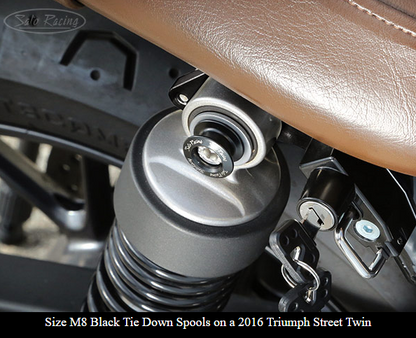 Sato Racing M6/M8 anodized aluminum motorcycle cargo anchors with tie-down spools, designed for secure bike transport.