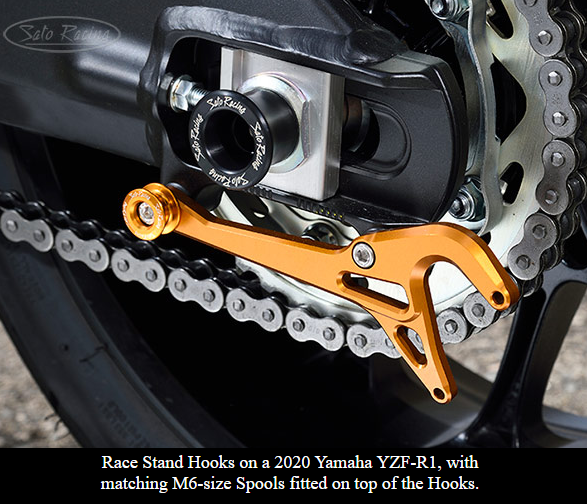 Sato Racing M6/M8 anodized aluminum motorcycle cargo tie-down spools with secure anchoring points.