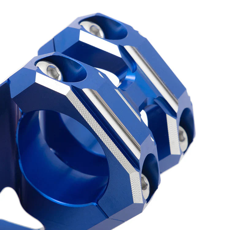Blue solid-mount handlebar riser for Surron LBX, Talaria, and E Ride Pro eDirtyBike Mantis X electric bikes, shown close-up.