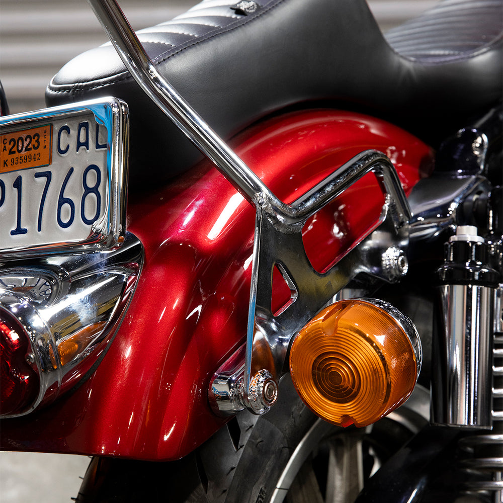 Chrome BILTWELL EXFIL Sissy Bar XL for motorcycle, mounted on bike body with polished metal finish and classic design.