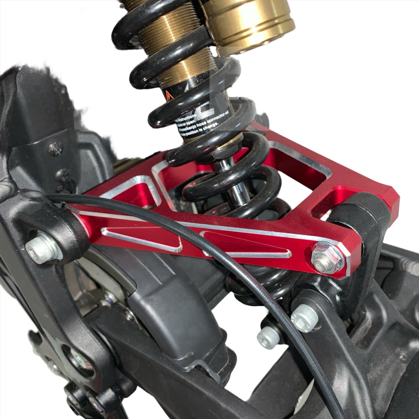 Red aluminum suspension triangle for Surron Light Bee DB by eDirtyBike, mounted on bike showing detailed construction and finish.