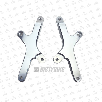 Silver Surron Light Bee LBX Seat Riser X-Tension Kit by eDirtyBike, showing the elevated seat riser on the electric bike.