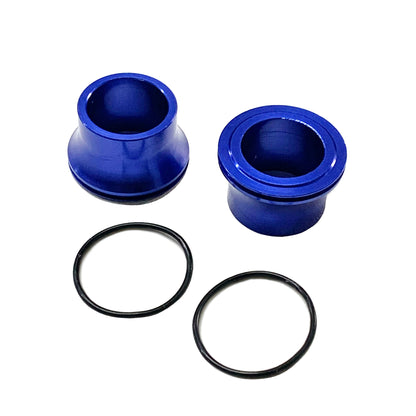 Blue front wheel spacer set for Surron LBX, Talaria Sting, MX3, MX4, and E Ride Pro bikes by eDirtyBike, shown installed on wheel.