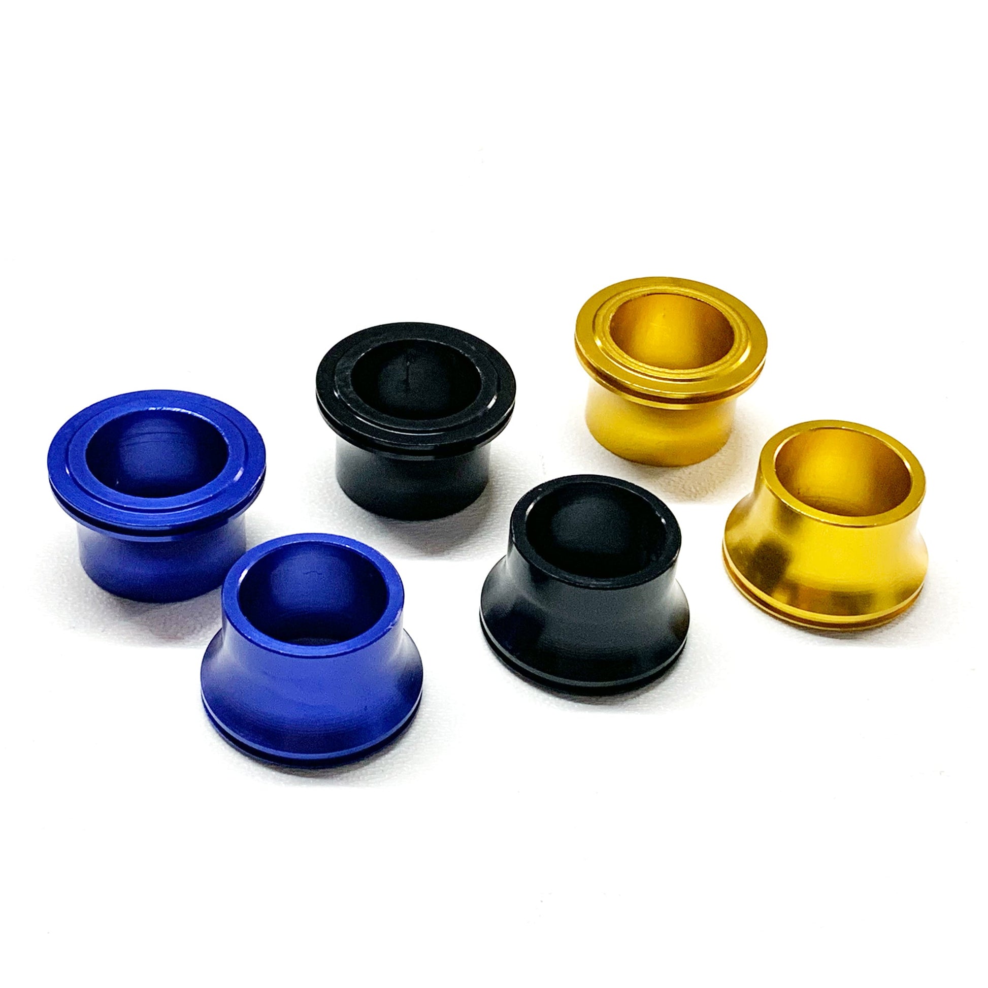 eDirtyBike front wheel spacer set for Surron LBX, Talaria Sting, MX3, MX4, and E Ride Pro electric bikes, showing colorful spacers.