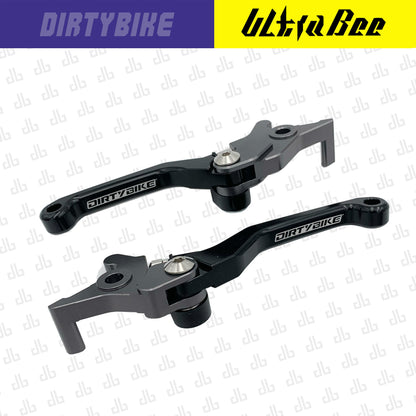 Black CNC aluminum folding brake lever set for Surron Ultra Bee electric bike by eDirtyBike, designed for durability and easy folding.