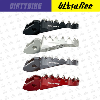 Aluminum CNC heavy-duty foot pegs for Sur-Ron Ultra Bee electric bike by eDirtyBike, featuring textured surface for grip.