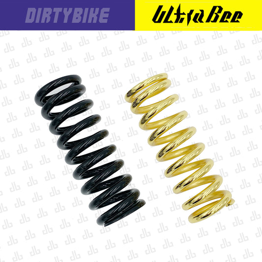 Rear shock spring for Surron Ultra Bee electric bike by eDirtyBike, showcasing a high-performance suspension component.