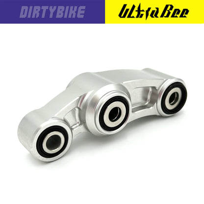 CNC aluminum suspension linkage for Surron Ultra Bee electric bike by eDirtyBike, silver-colored and designed for enhanced ride stability.