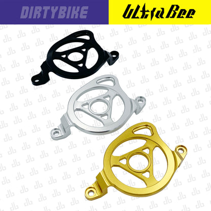 CNC aluminum motor sprocket cover for Surron Ultra Bee electric bike by eDirtyBike, showcasing a sleek, durable design.