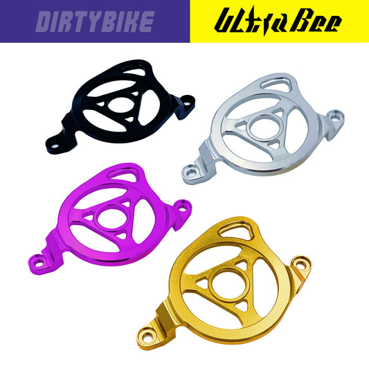 CNC aluminum motor sprocket cover for Surron Ultra Bee electric bike, with sleek metallic finish and precise fit.