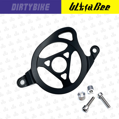 Black CNC aluminum motor sprocket cover for Surron Ultra Bee electric bike by eDirtyBike, showcasing durable protective design.