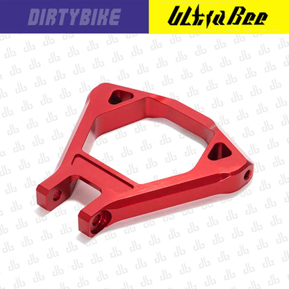 Red CNC aluminum suspension triangle for Surron Ultra Bee electric bike by eDirtyBike, designed for enhanced ride stability.