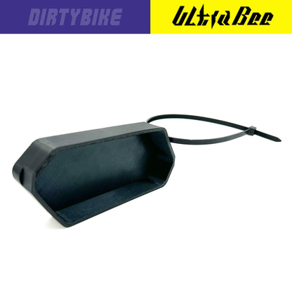 Black Gauge Protector Cover for Surron Ultra Bee by eDirtyBike, designed to shield the gauge area from dust and damage.