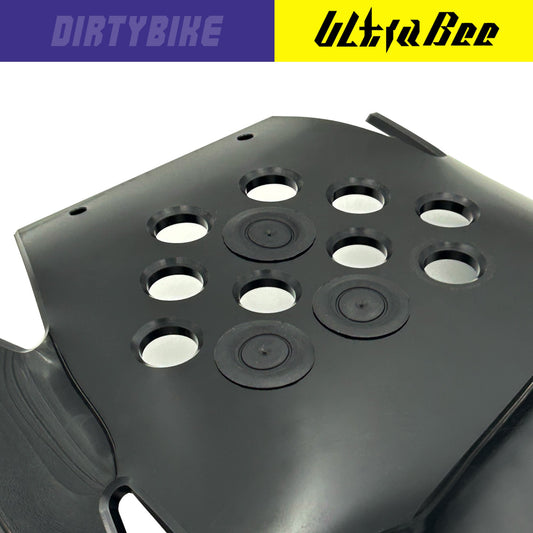 eDirtyBike Hard Enduro skid plate mud plugs on Surron Ultra Bee off-road motorcycle for protection and durability.