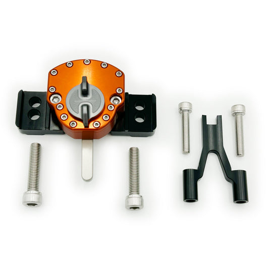 Orange Surron Ultra Bee steering damper by eDirtyBike mounted on the motorcycle, showcasing its robust design and branding.