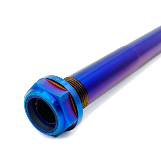 Titanium rear axle for Surron Ultra Bee electric bike by eDirtyBike, showcasing the durable, lightweight axle component.