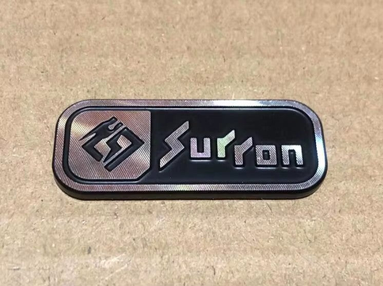 Surron Logo Badge - Howling Moto