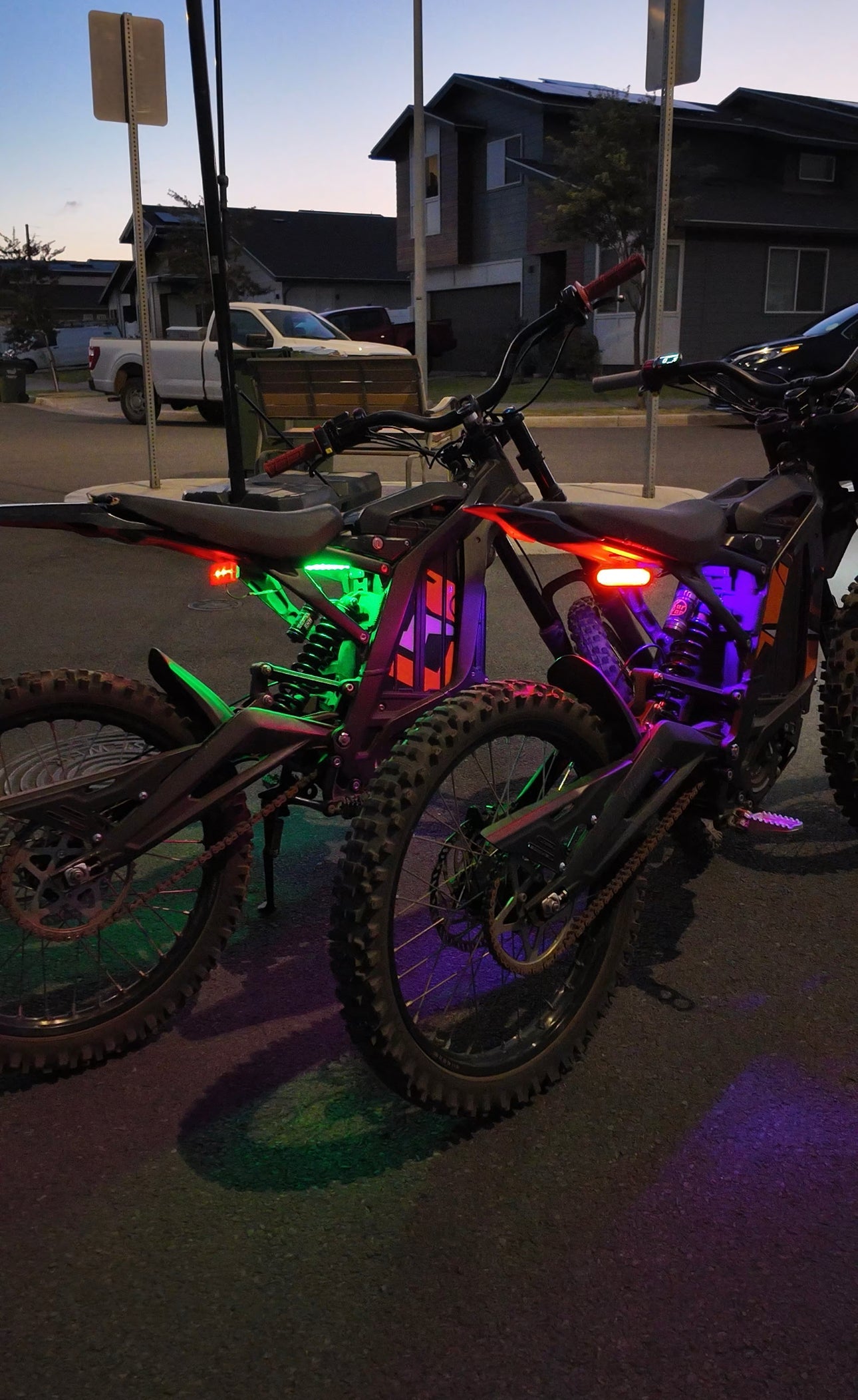 Green and purple rear underglow kit for Surron Talaria MX4/MX5 electric motorcycle by Project9, showcasing vibrant LED lighting.