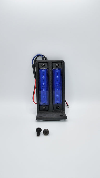 Surron under glow kit from Project9 featuring colorful LED lights installed on a Surron electric bike's rear underside.
