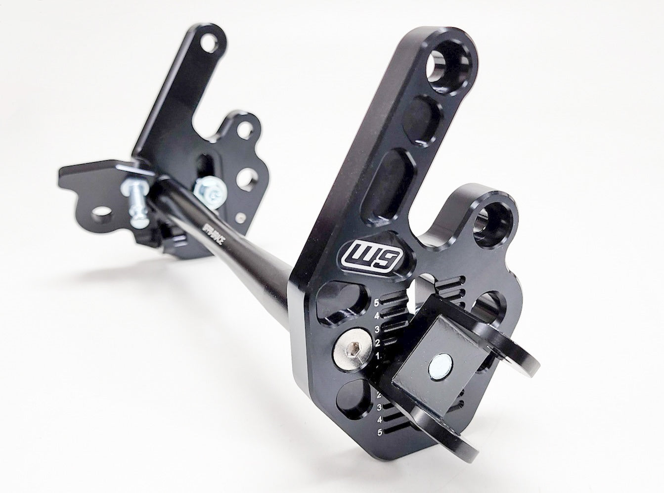 Warp9Racing Sur-ron LBX and 79Bike adjustable foot peg mount, black metal with mounting hardware visible for enhanced rider comfort.
