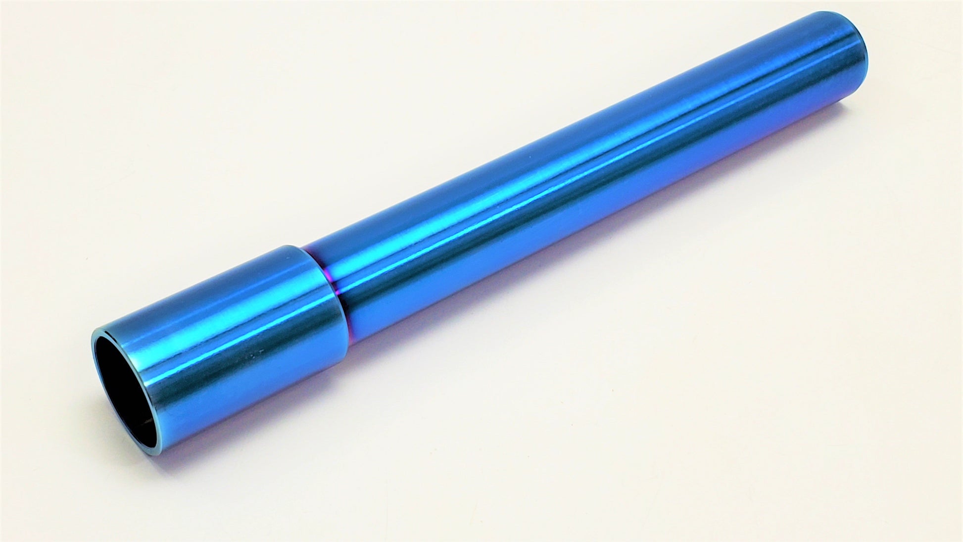 Close-up of Warp9Racing titanium axles showcasing their lightweight, durable design with detailed branding on a white background.